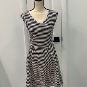 Dress. Black and white stripe not the swirls in the photo!